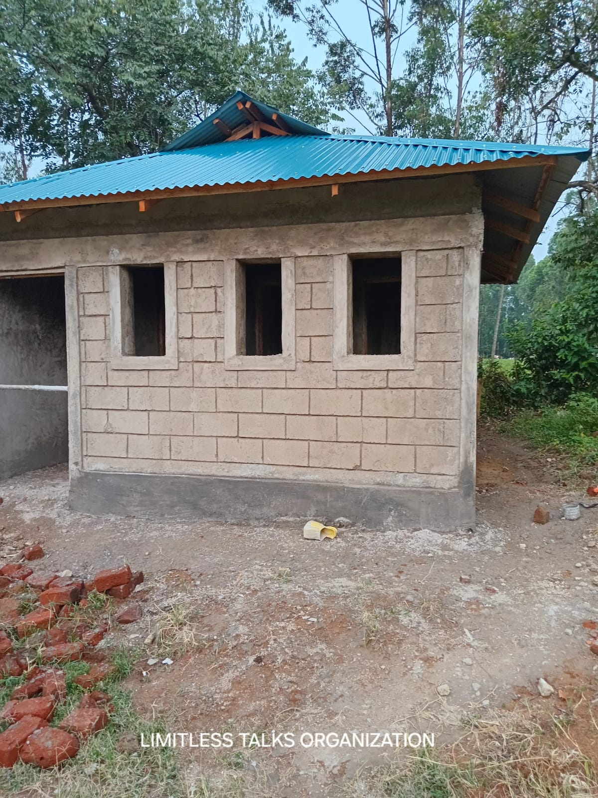 The new toilet block at Eshisenye Primary School under construction, walled and roofed